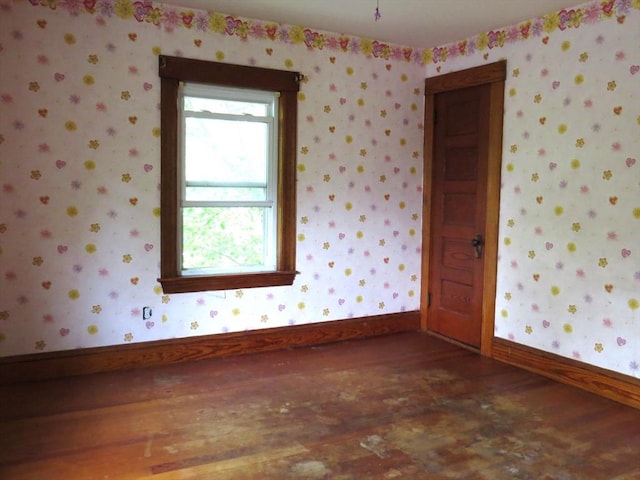 187 High St, Billerica, MA 01862 - empty room featuring wood finished floors, baseboards, and wallpapered walls