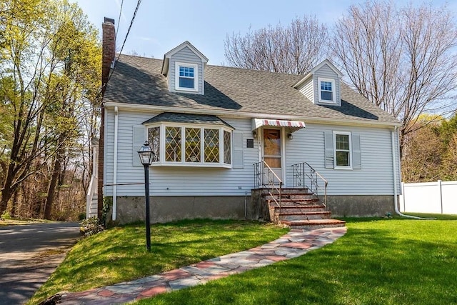1049 Pleasant St, Canton, MA 02021 - cape cod-style house featuring fence, a chimney, and a front yard
