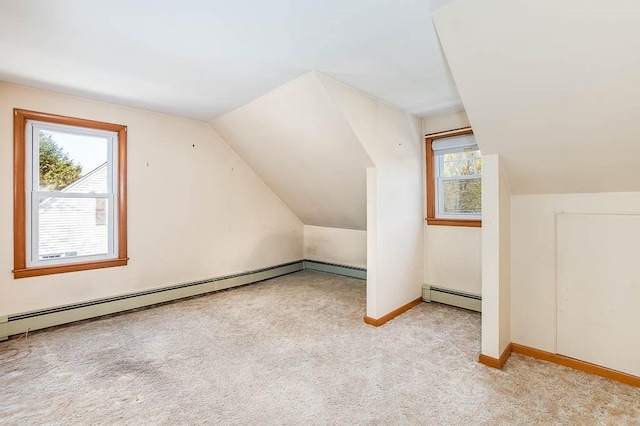 1049 Pleasant St, Canton, MA 02021 - additional living space with carpet floors, lofted ceiling, and a baseboard heating unit