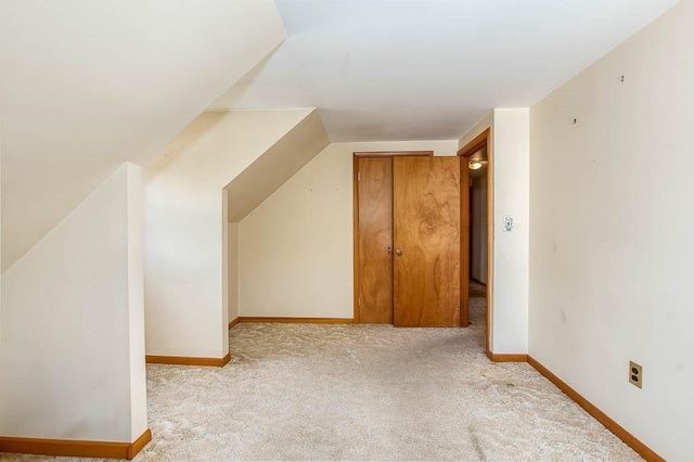 1049 Pleasant St, Canton, MA 02021 - bonus room featuring vaulted ceiling, baseboards, and carpet flooring
