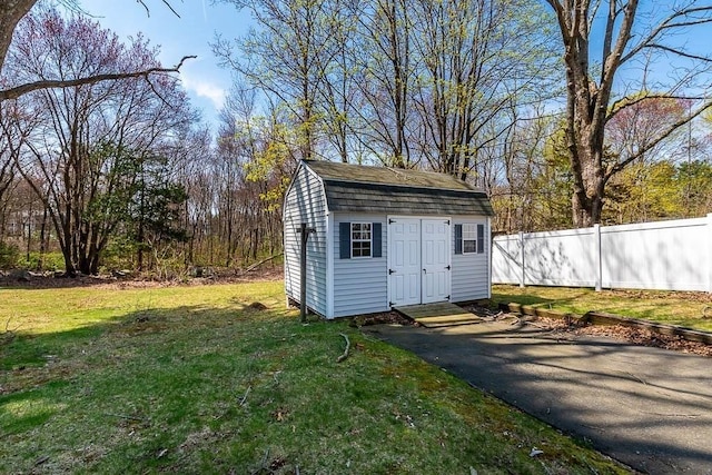 1049 Pleasant St, Canton, MA 02021 - view of shed featuring aphalt driveway and fence