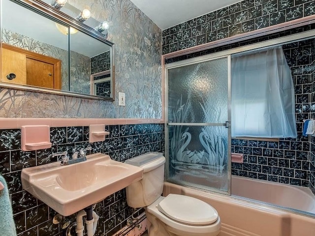 1049 Pleasant St, Canton, MA 02021 - full bath featuring a sink, toilet, enclosed tub / shower combo, tile walls, and backsplash