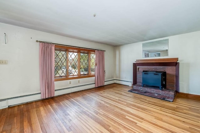 1049 Pleasant St, Canton, MA 02021 - unfurnished living room with a brick fireplace and hardwood / wood-style flooring