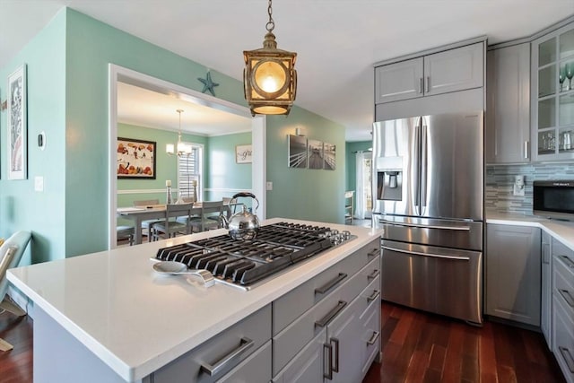 69 Leverett Ave, Revere, MA 02151 - kitchen with gray cabinets, appliances with stainless steel finishes, and dark wood-style floors