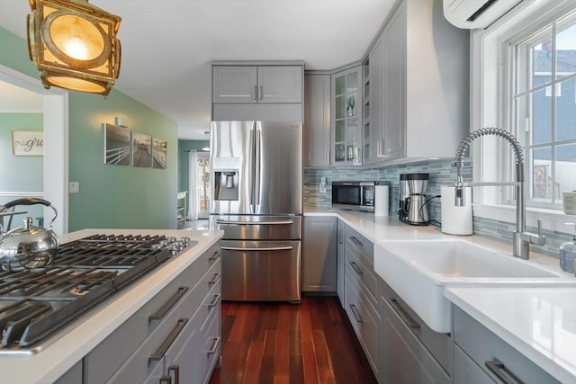 69 Leverett Ave, Revere, MA 02151 - kitchen with gray cabinetry, stainless steel appliances, a sink, and dark wood-style flooring
