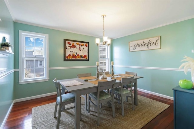 69 Leverett Ave, Revere, MA 02151 - dining room with hardwood / wood-style flooring, a chandelier, crown molding, and baseboards