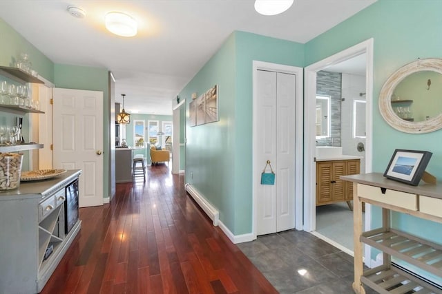 69 Leverett Ave, Revere, MA 02151 - hall featuring dark wood-type flooring and baseboards