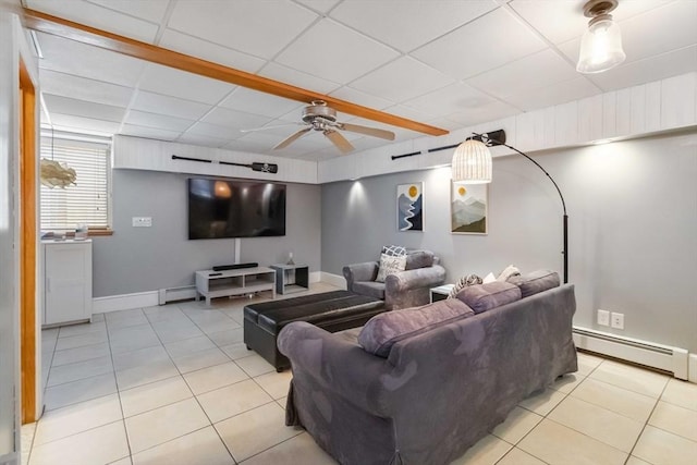 69 Leverett Ave, Revere, MA 02151 - home theater room featuring a baseboard radiator, light tile patterned flooring, a ceiling fan, baseboards, and baseboard heating