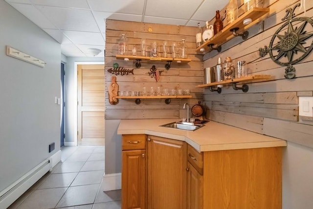 69 Leverett Ave, Revere, MA 02151 - indoor wet bar featuring baseboard heating, a paneled ceiling, wood walls, and light tile patterned flooring