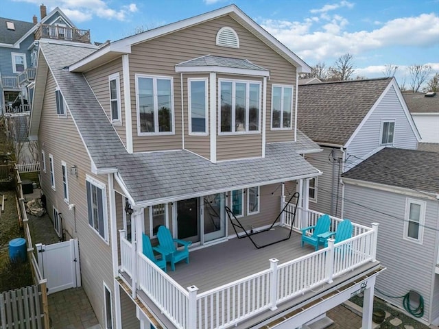69 Leverett Ave, Revere, MA 02151 - rear view of house with roof with shingles, a gate, and a deck