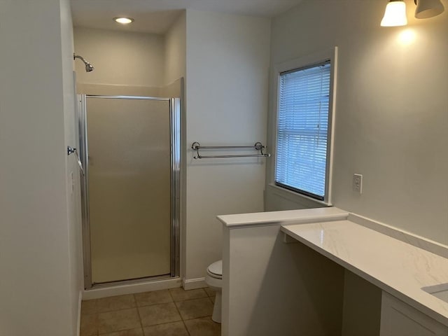 full bath with toilet, a shower stall, tile patterned flooring, and vanity