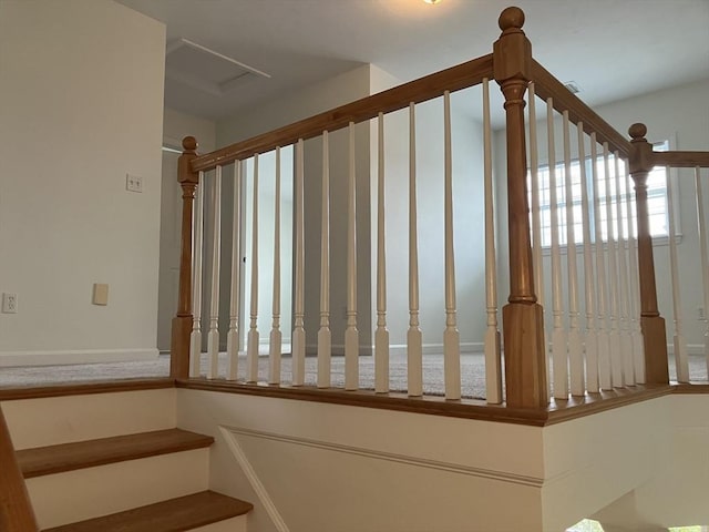 stairs featuring attic access