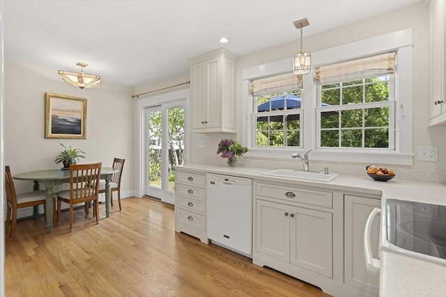 3 Roosevelt Pl, Newburyport, MA 01950 - kitchen featuring white dishwasher, a sink, and light countertops