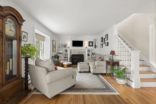 3 Roosevelt Pl, Newburyport, MA 01950 - living room featuring stairway, wood finished floors, and a fireplace