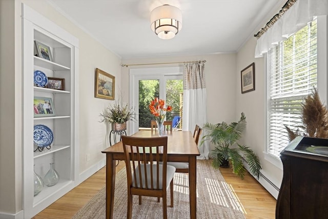 3 Roosevelt Pl, Newburyport, MA 01950 - dining area with light wood-style floors and ornamental molding