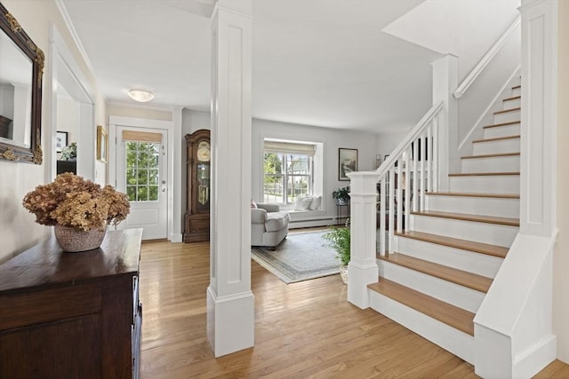 3 Roosevelt Pl, Newburyport, MA 01950 - foyer entrance featuring healthy amount of natural light, a baseboard heating unit, stairs, and light wood-type flooring