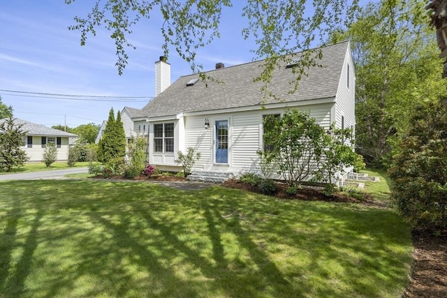 3 Roosevelt Pl, Newburyport, MA 01950 - new england style home featuring roof with shingles, a front lawn, and a chimney