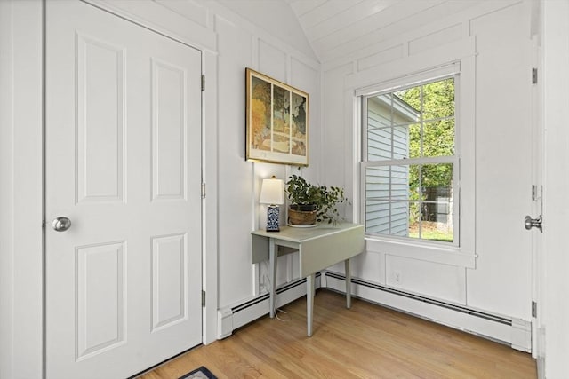 3 Roosevelt Pl, Newburyport, MA 01950 - entryway featuring vaulted ceiling, light wood-style floors, baseboard heating, and a decorative wall