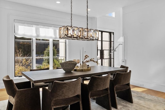 dining area featuring recessed lighting, light wood-style flooring, and baseboards