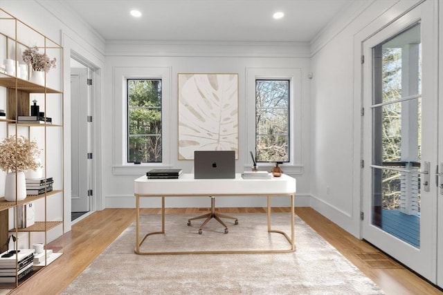 office space with recessed lighting, light wood-style flooring, and baseboards