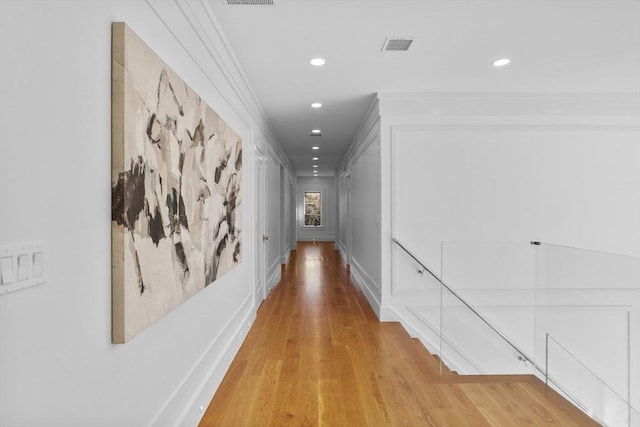 hall featuring visible vents, wood finished floors, and recessed lighting