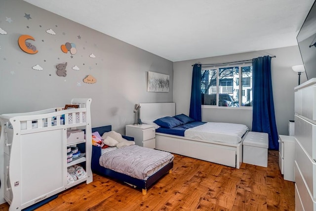 bedroom with light hardwood / wood-style floors