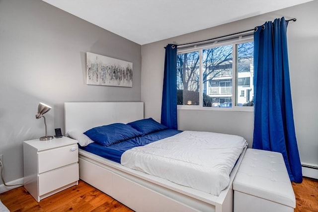 bedroom with light wood-type flooring