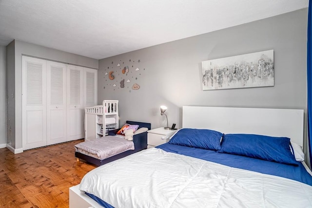 bedroom with hardwood / wood-style floors and a closet