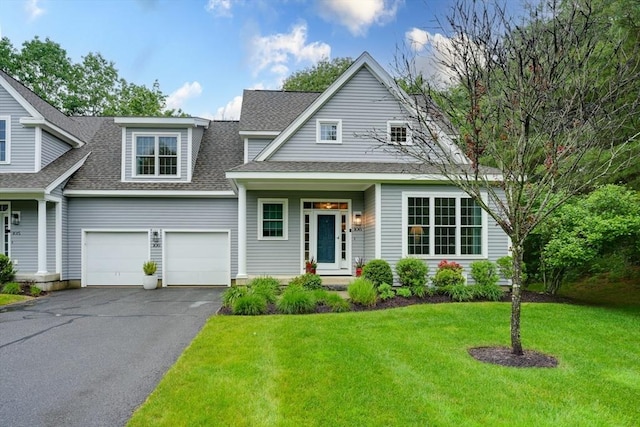 106 Willow Brook Dr Unit 106, Wayland, MA 01778 - view of front of house featuring a shingled roof, driveway, and a front lawn