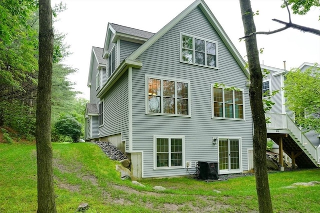 106 Willow Brook Dr Unit 106, Wayland, MA 01778 - rear view of house featuring a yard, stairs, and a deck