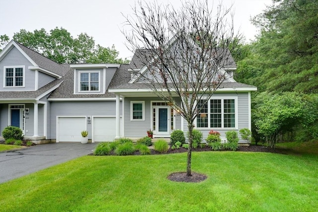 106 Willow Brook Dr Unit 106, Wayland, MA 01778 - view of front of home featuring driveway, an attached garage, a shingled roof, and a front yard