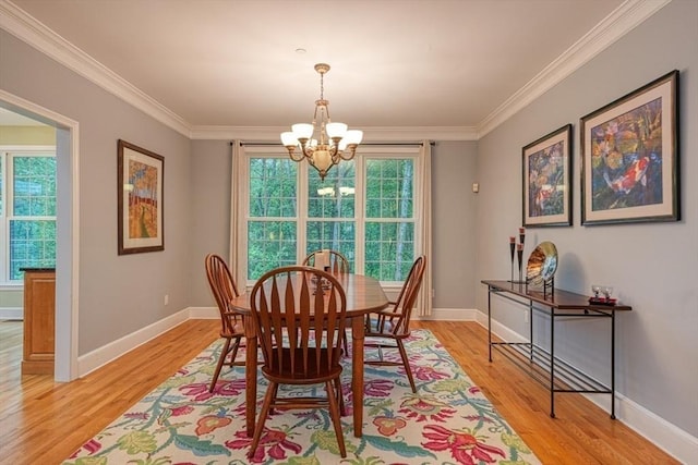 106 Willow Brook Dr Unit 106, Wayland, MA 01778 - dining room featuring a chandelier, light wood finished floors, and crown molding