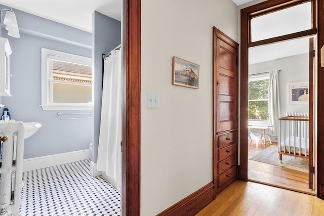 30 Welles Ave Unit 2, Boston, MA 02124 - hallway with baseboards and light wood-style floors