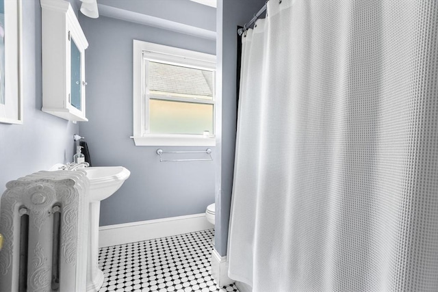 30 Welles Ave Unit 2, Boston, MA 02124 - bathroom with toilet, tile patterned floors, baseboards, and a shower with curtain