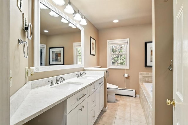 bathroom with a sink, tile patterned flooring, a baseboard heating unit, and toilet
