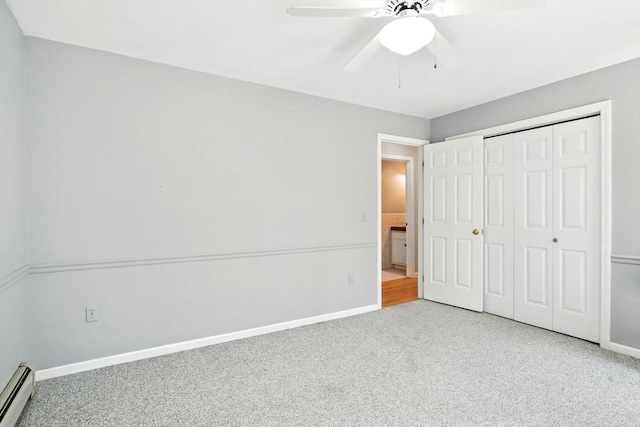 unfurnished bedroom featuring ceiling fan, baseboards, a baseboard radiator, a closet, and carpet flooring