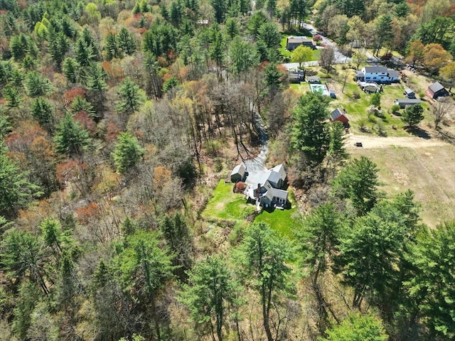 bird's eye view featuring a wooded view