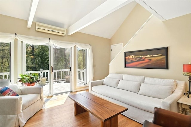 living room with lofted ceiling with beams, a wall mounted AC, and wood finished floors
