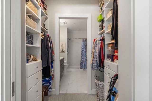 130 Broad Reach Unit 303, Weymouth, MA 02191 - walk in closet featuring light marble finish floors
