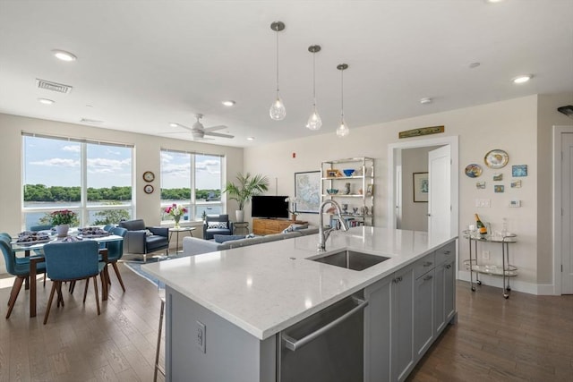130 Broad Reach Unit 303, Weymouth, MA 02191 - kitchen with stainless steel dishwasher, a sink, dark wood finished floors, ceiling fan, and open floor plan