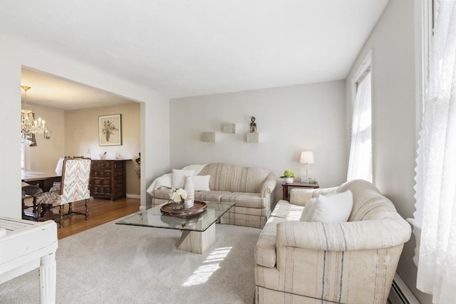 living area featuring a chandelier and wood finished floors