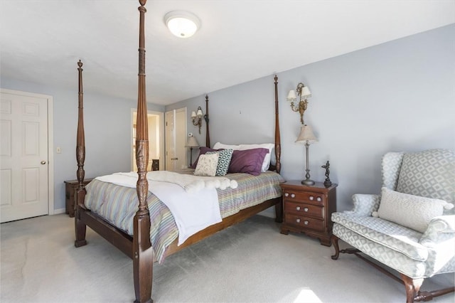 bedroom featuring light carpet