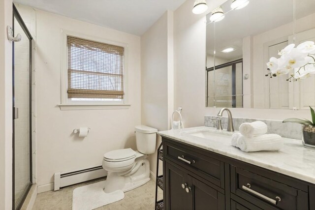 full bathroom with toilet, a stall shower, a baseboard radiator, baseboards, and vanity