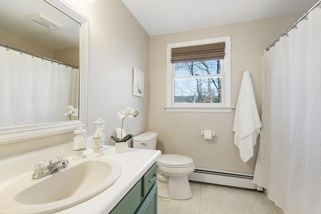 full bath with vanity, toilet, and baseboard heating