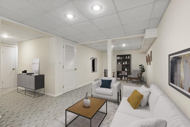 living area featuring a drop ceiling, baseboards, carpet floors, and recessed lighting