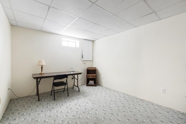 office space featuring a paneled ceiling and carpet flooring