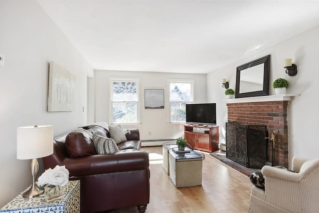 living room featuring a fireplace, wood finished floors, and a baseboard radiator