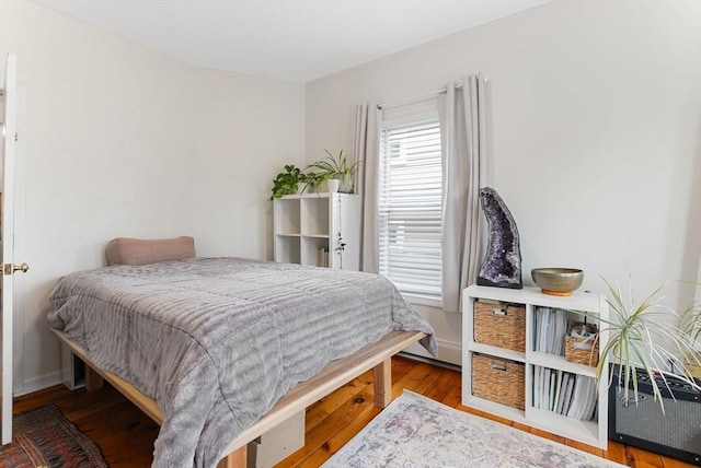 bedroom featuring wood-type flooring