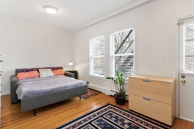 bedroom with hardwood / wood-style flooring