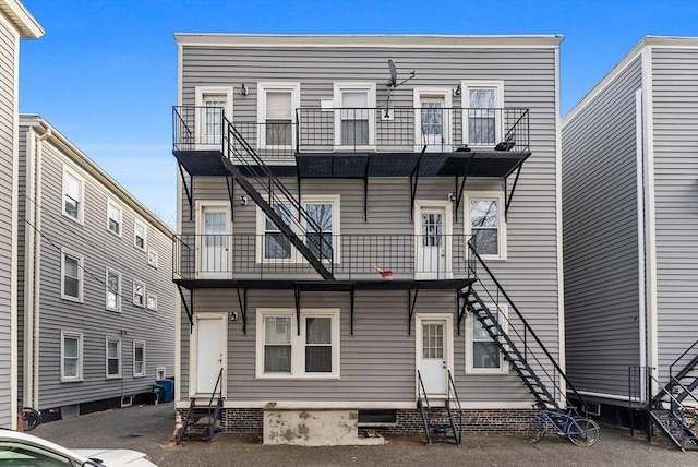 rear view of house with a balcony